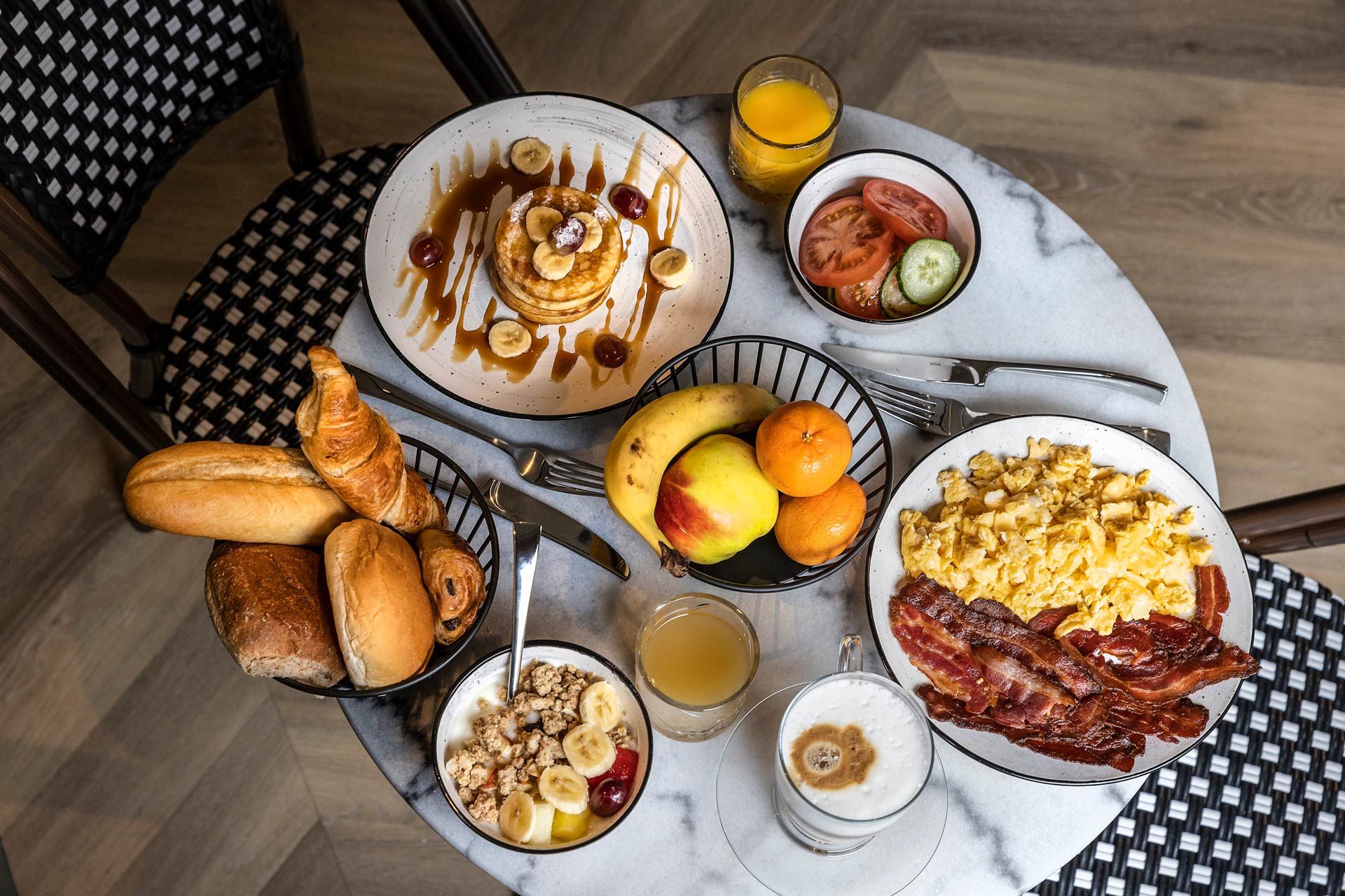 The Royal Breakfast laid out: eggs, bread, fruit and juice