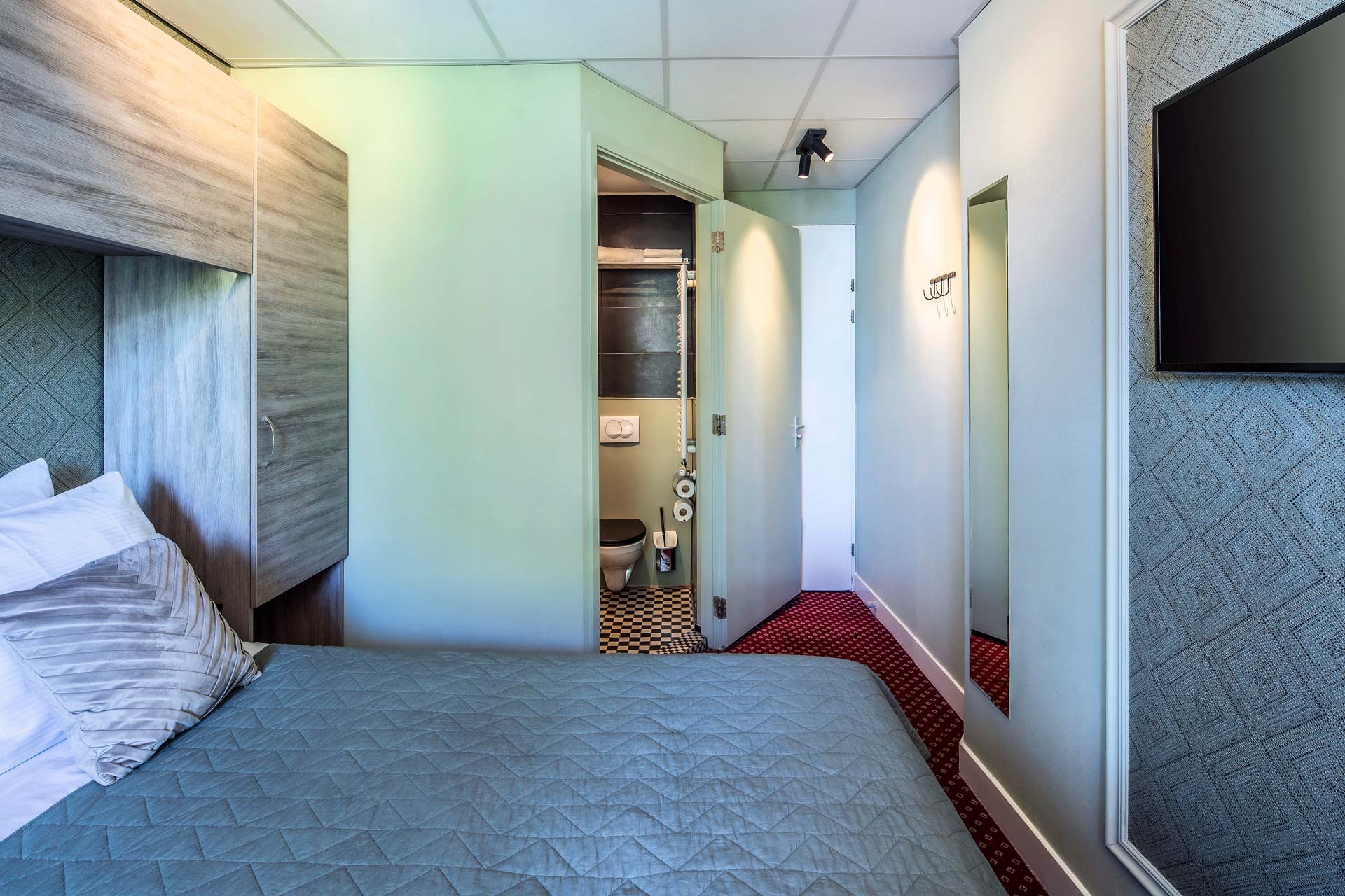 The wardrobe, mirror and television