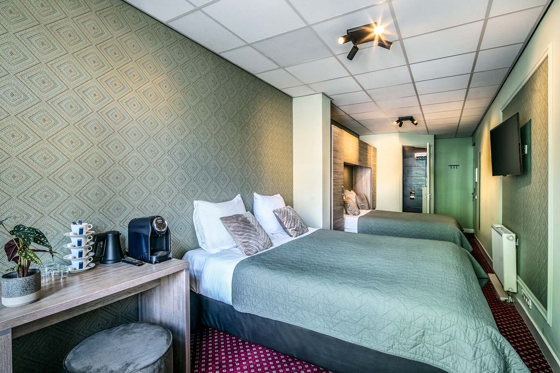 The beds, coffee station and television