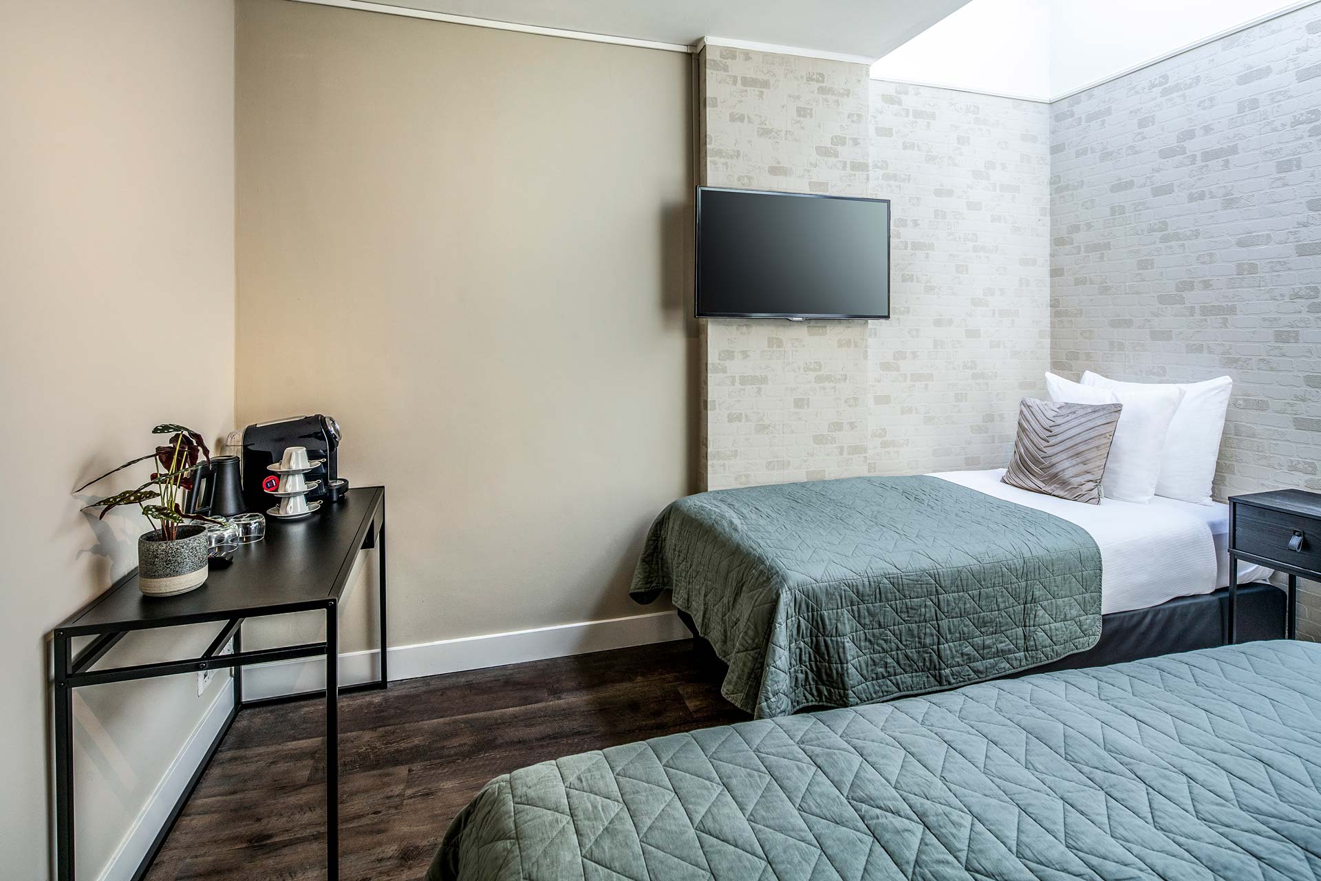 The two beds, coffee station and television